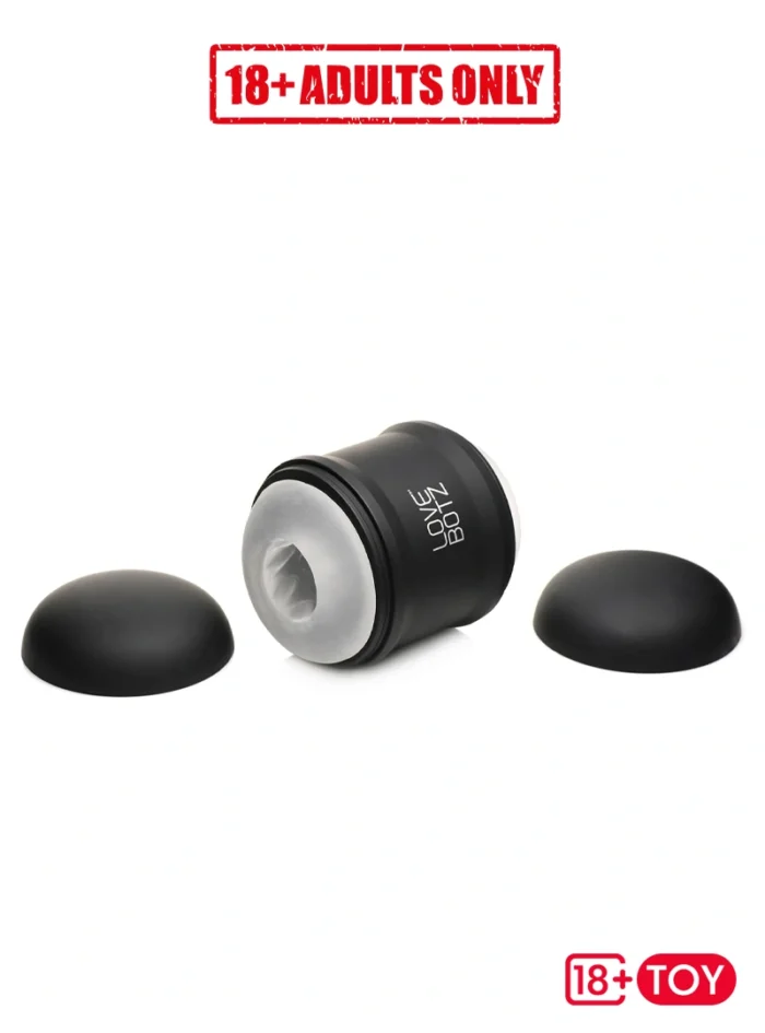Vibrating male stroker lying on flat surface