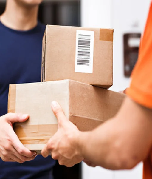 Indian courier handing a discreet plain box to customer at doorstep
